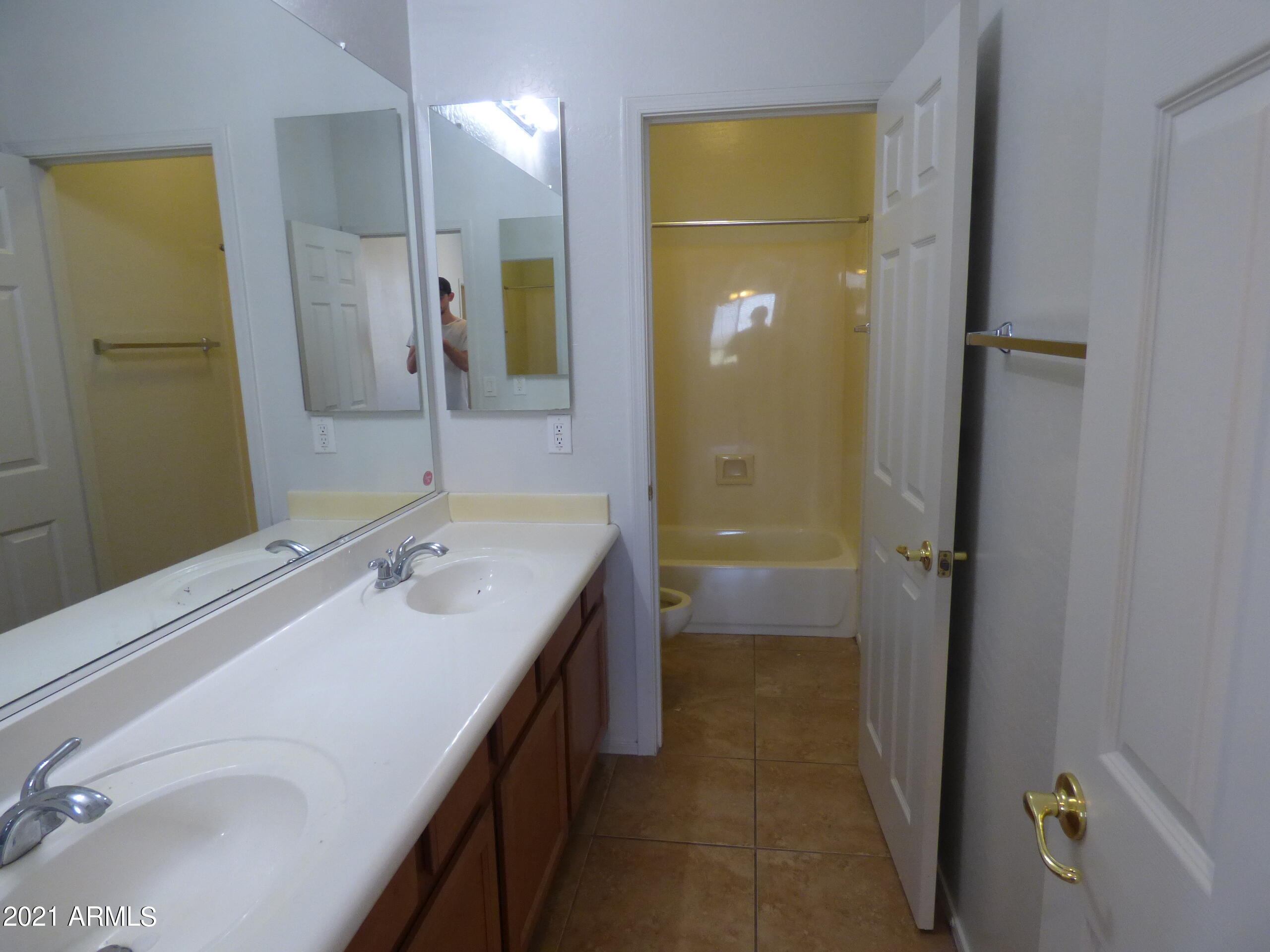 5617 West Carson Road Laveen, AZ 85339 - Photo 46 of 56 a bathroom with a sink a mirror and a shower