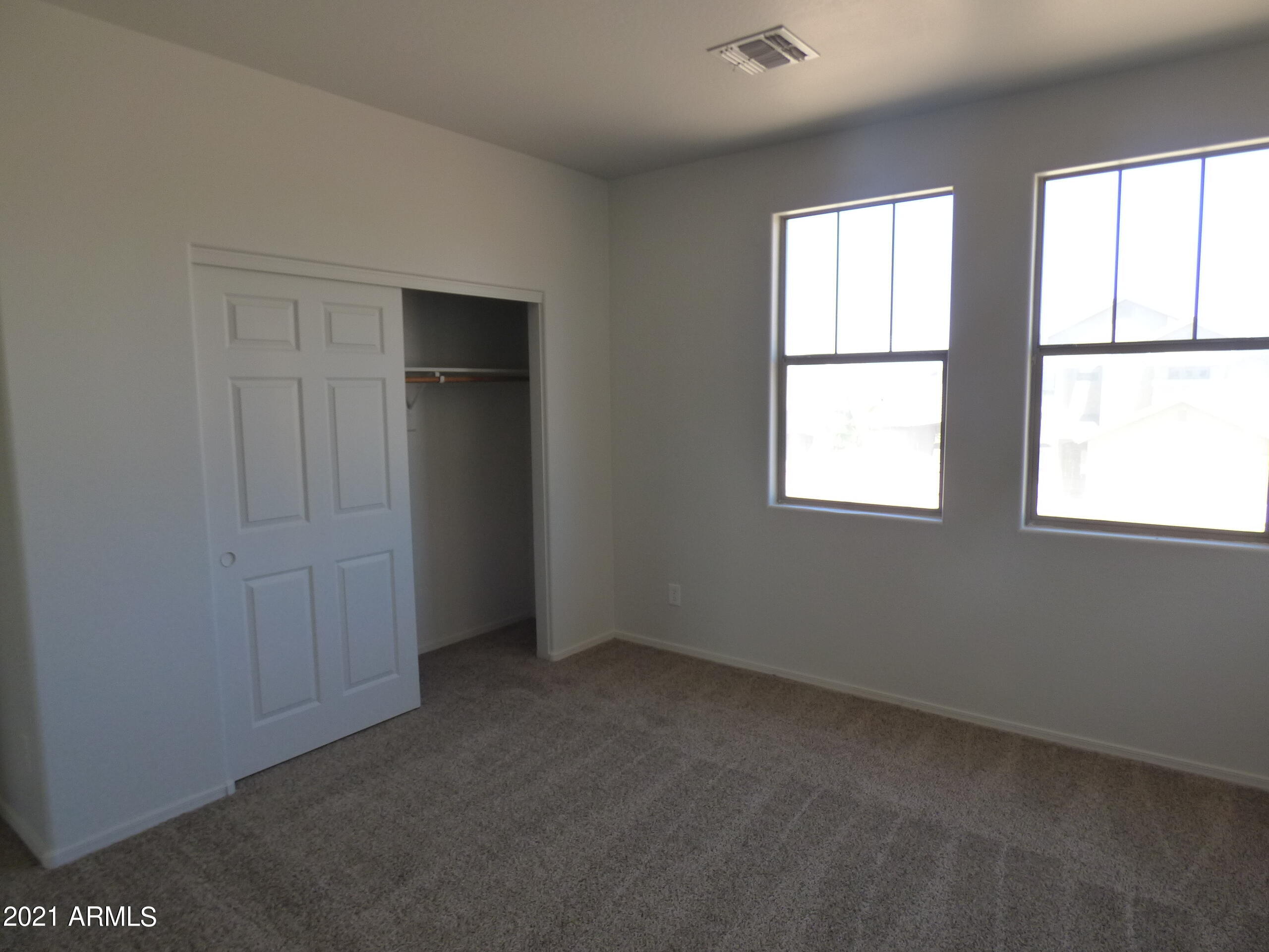 5617 West Carson Road Laveen, AZ 85339 - Photo 53 of 56 an empty room with windows