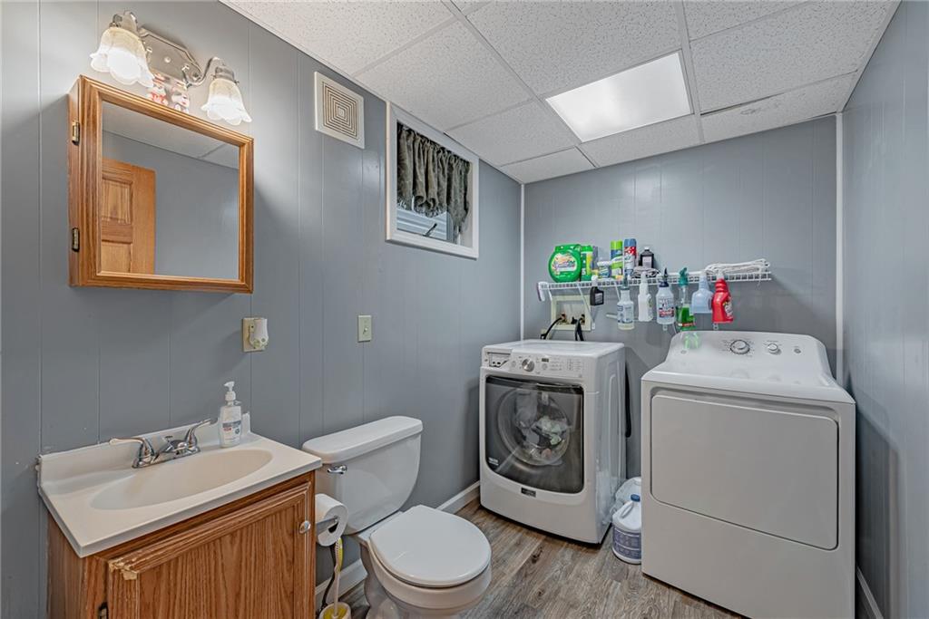 121 Hamilton Avenue Vandergrift, PA 15690 - Photo 13 of 25 a bathroom with a toilet sink and mirror