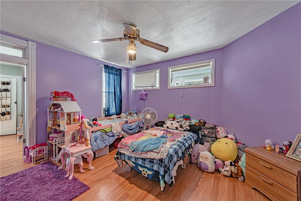 121 Hamilton Avenue Vandergrift, PA 15690 - Photo 14 of 25 a bedroom with furniture and a mirror