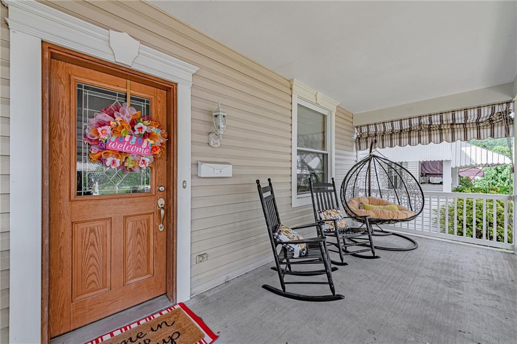 121 Hamilton Avenue Vandergrift, PA 15690 - Photo 2 of 25 wooden floor in a livingroom with a dining table and a window