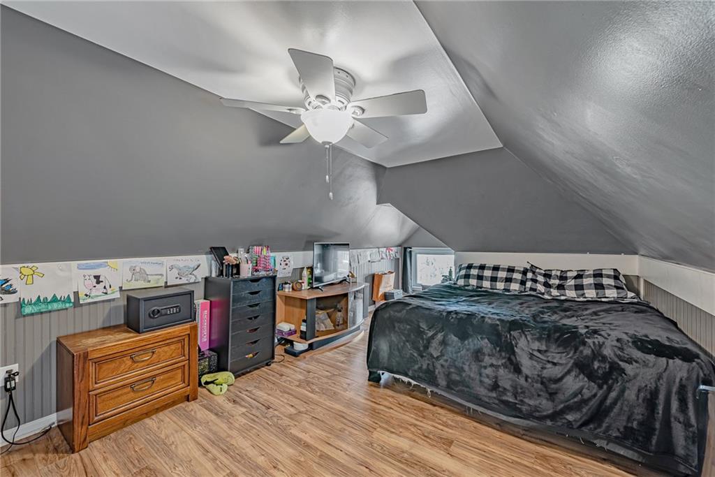 121 Hamilton Avenue Vandergrift, PA 15690 - Photo 21 of 25 a view of a bedroom with furniture and wooden floor