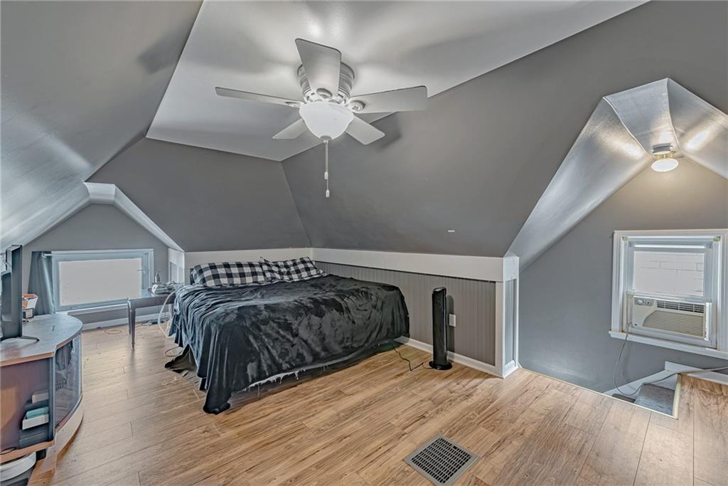 121 Hamilton Avenue Vandergrift, PA 15690 - Photo 22 of 25 a bedroom with a bed and wooden floor