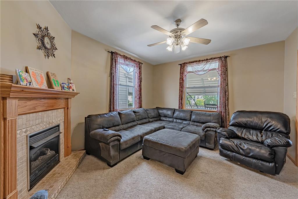 121 Hamilton Avenue Vandergrift, PA 15690 - Photo 4 of 25 a living room with furniture and a fireplace