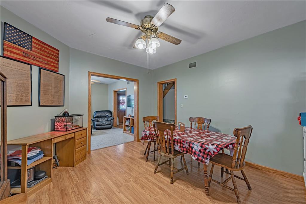 121 Hamilton Avenue Vandergrift, PA 15690 - Photo 7 of 25 a view of a dining room with furniture and wooden floor