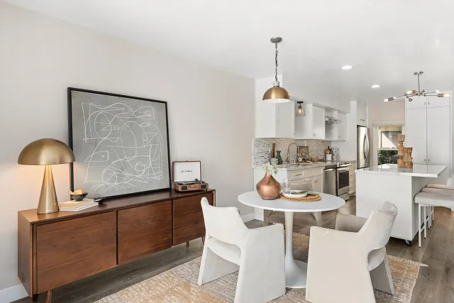 a dining room with furniture and window