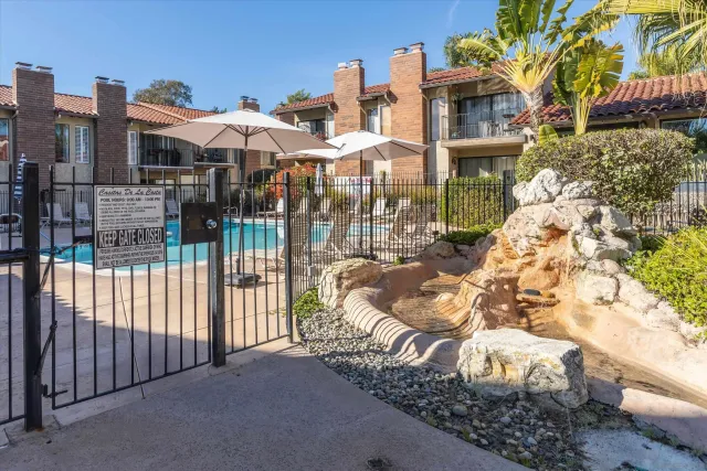 a swimming pool with outdoor seating and yard