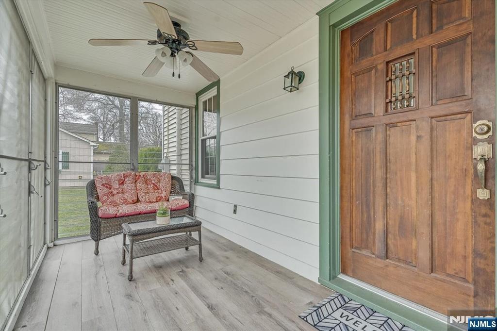 27 Prospect Avenue Pompton Plains, NJ 07444 - Photo 14 of 26 a living room with furniture a ceiling fan and a rug