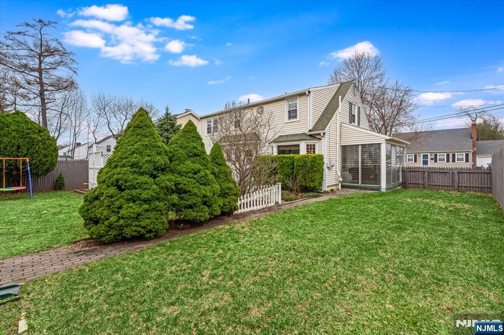 27 Prospect Avenue Pompton Plains, NJ 07444 - Photo 25 of 26 a front view of a house with a garden