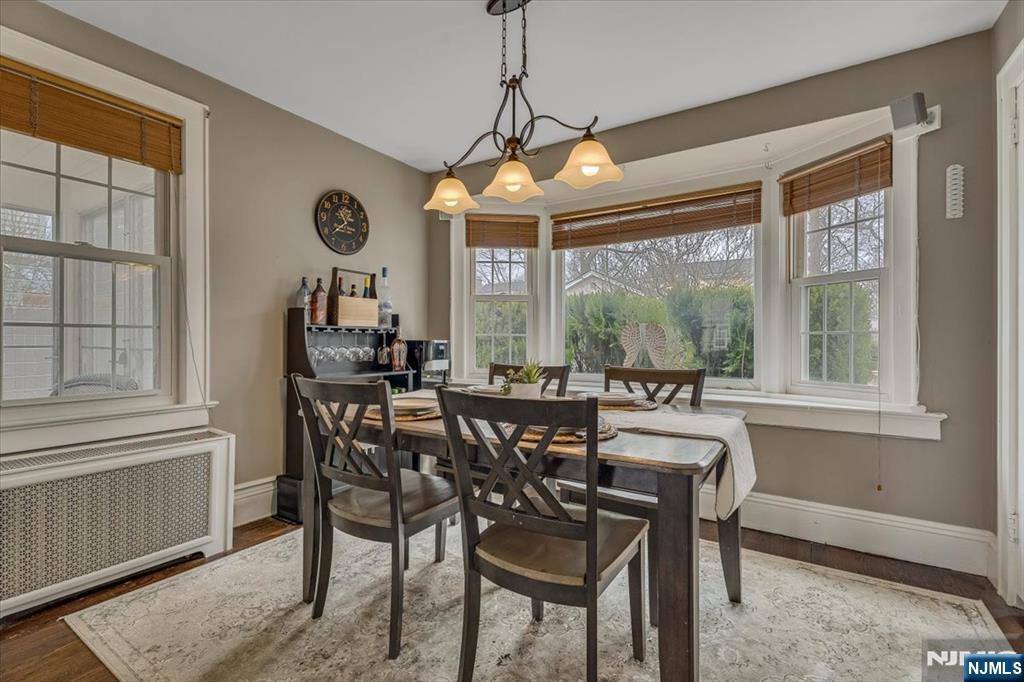 27 Prospect Avenue Pompton Plains, NJ 07444 - Photo 6 of 26 a dining room with furniture a chandelier and wooden floor