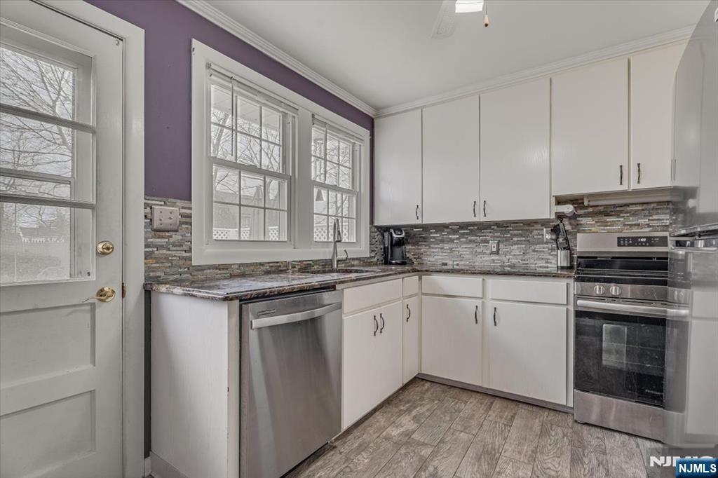 27 Prospect Avenue Pompton Plains, NJ 07444 - Photo 8 of 26 a kitchen with stainless steel appliances granite countertop a stove and a sink