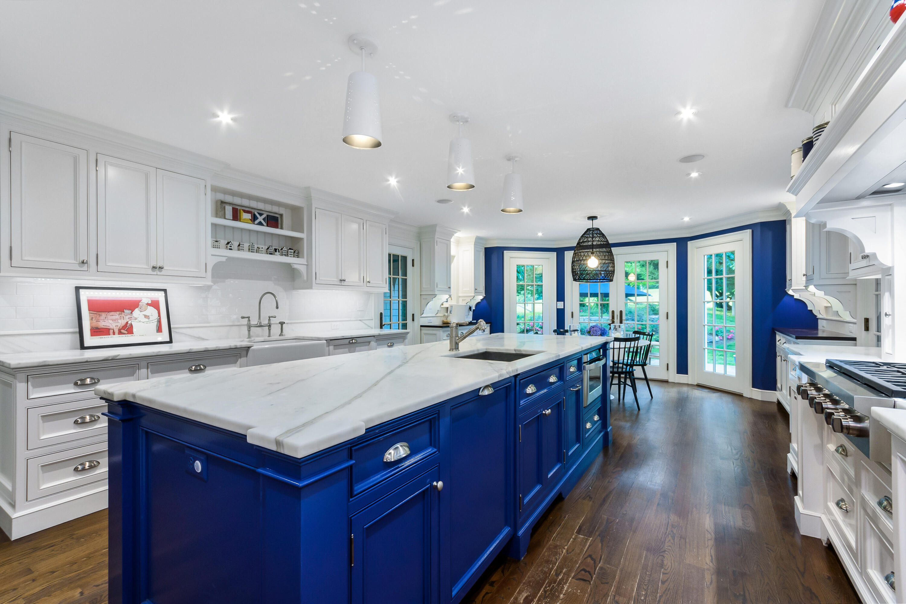 9 Sylvan Road Darien, CT 06820 - Photo 11 of 39 a large kitchen with stainless steel appliances granite countertop a large center island and a wooden floors