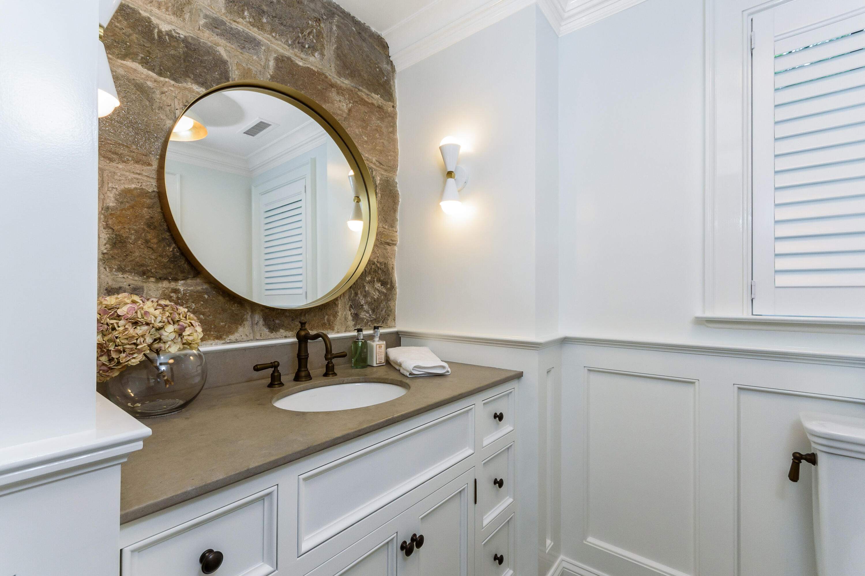 9 Sylvan Road Darien, CT 06820 - Photo 16 of 39 a bathroom with a sink and a mirror