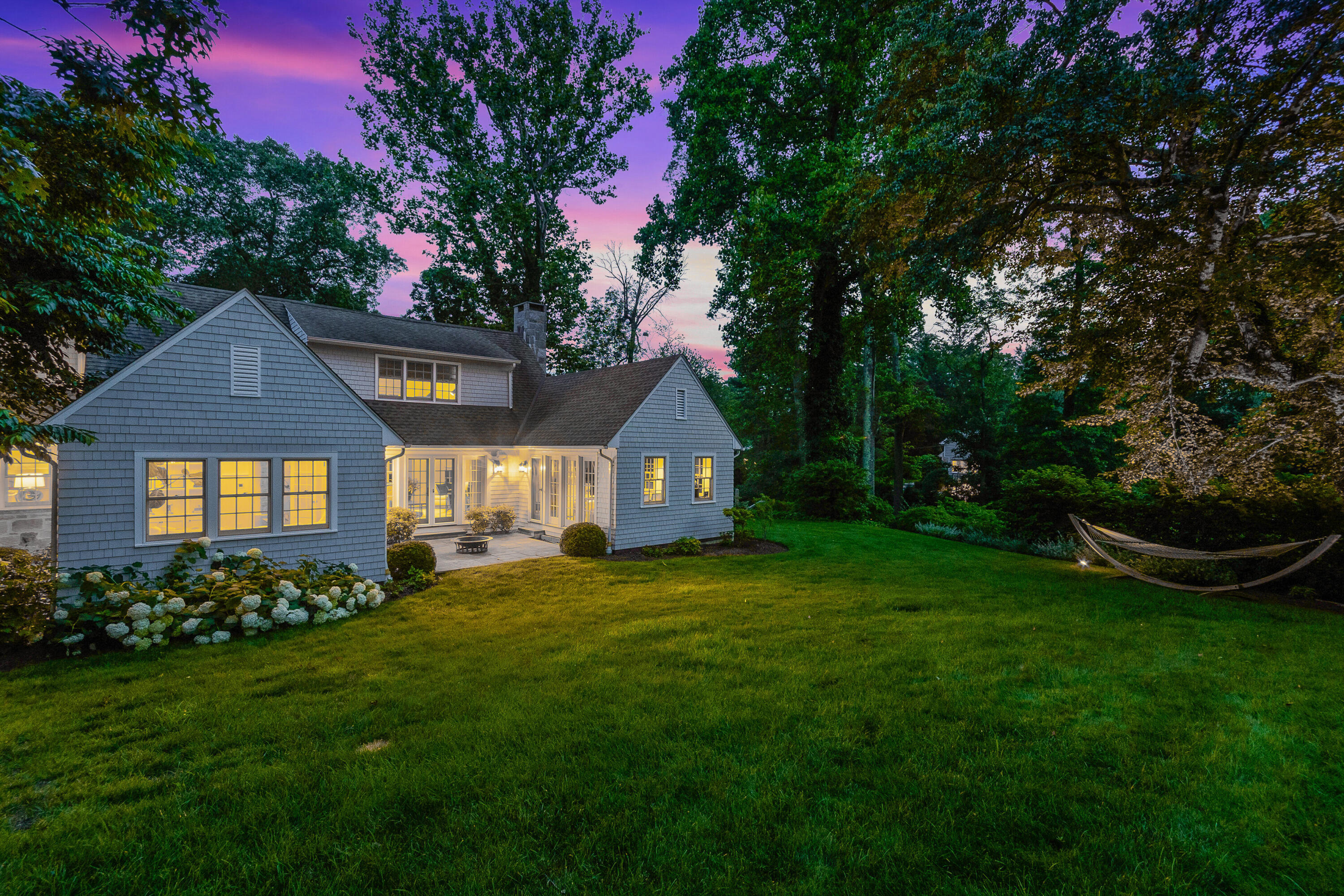 9 Sylvan Road Darien, CT 06820 - Photo 35 of 39 a front view of a house with a yard