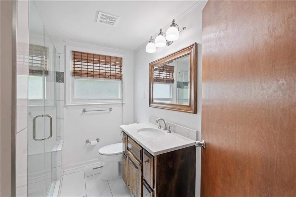 357 West Hightower Trail Social Circle, GA 30025 - Photo 22 of 41 a bathroom with a sink toilet and shower
