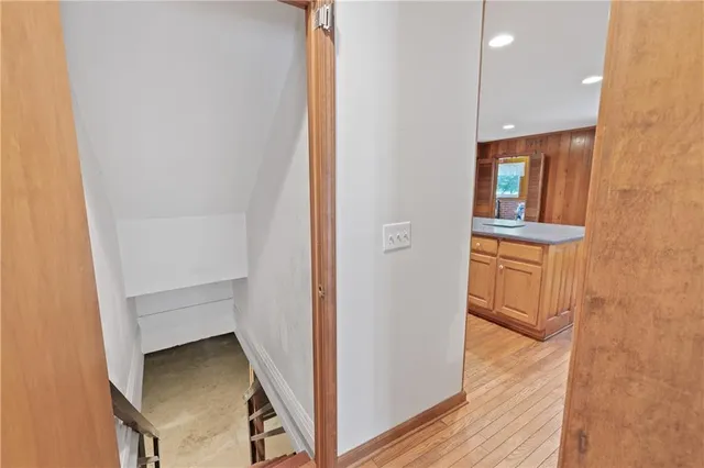 a view of a room with wooden walls