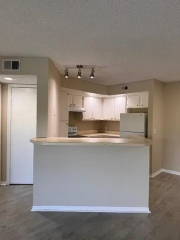a kitchen with stainless steel appliances a stove and a refrigerator