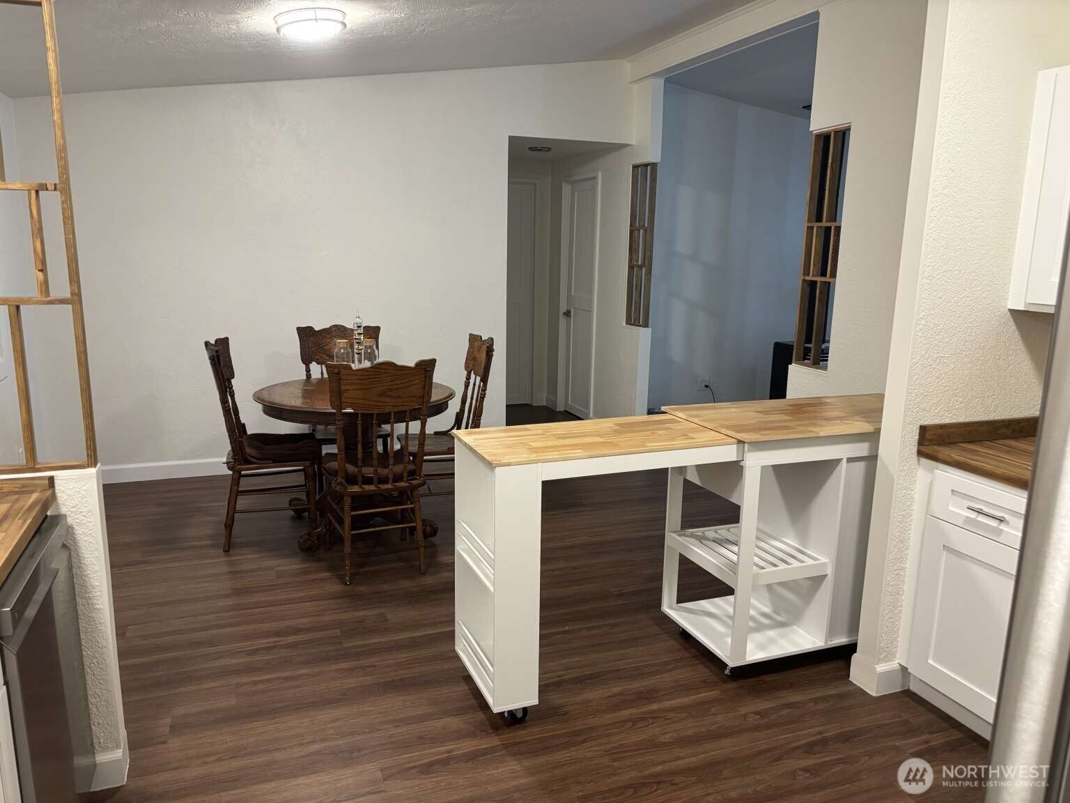 12615 Northeast 189th Street Bothell, WA 98011 - Photo 14 of 40 a room with furniture and wooden floor