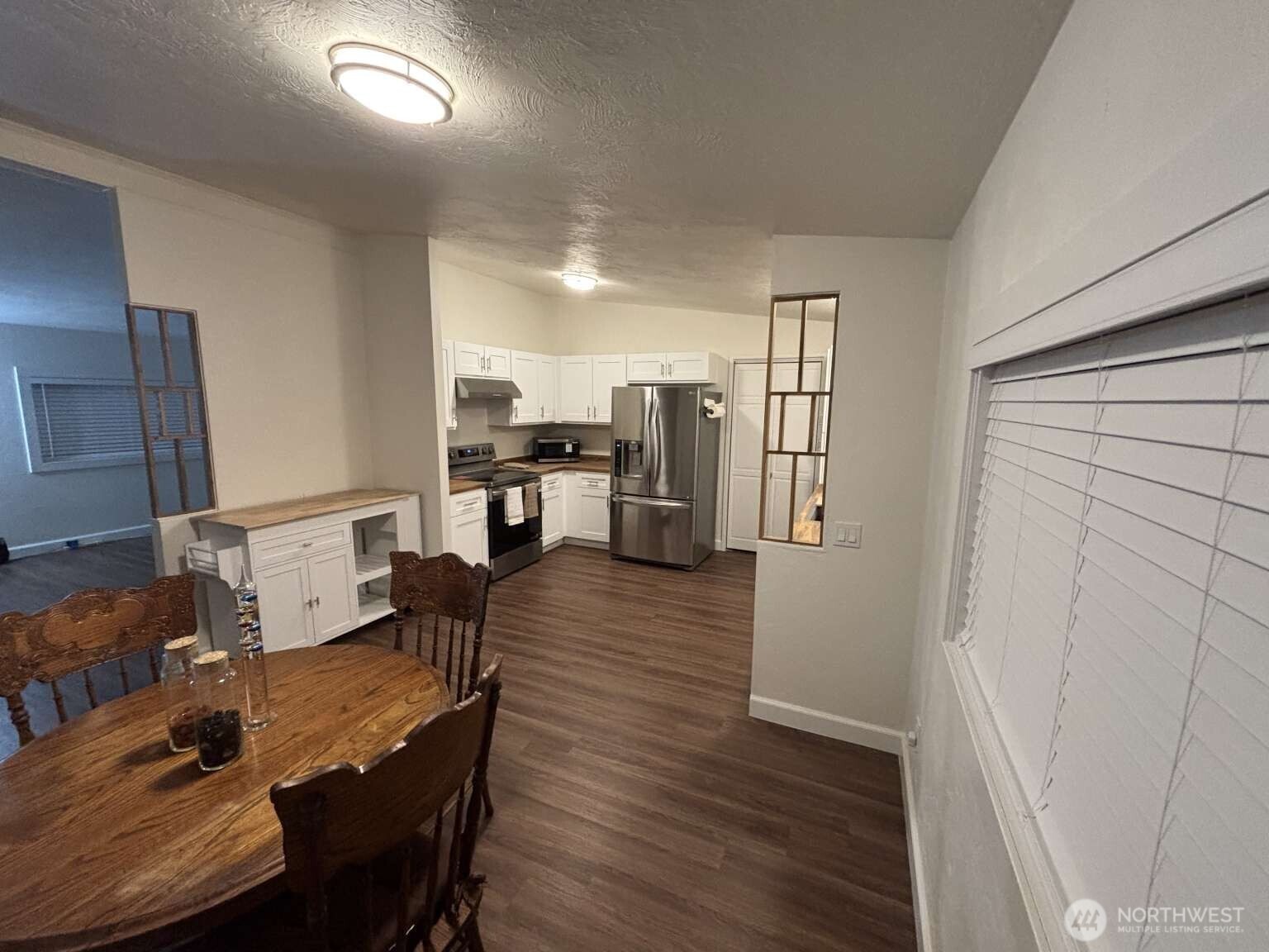 12615 Northeast 189th Street Bothell, WA 98011 - Photo 15 of 40 a living room with furniture and a wooden floor