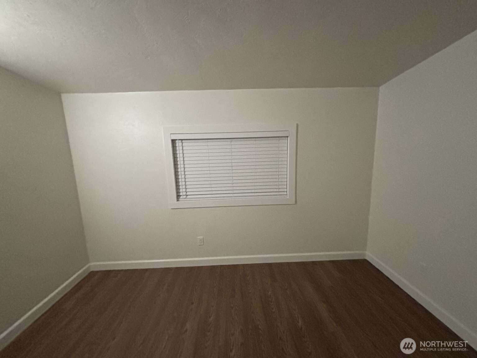 12615 Northeast 189th Street Bothell, WA 98011 - Photo 25 of 40 a view of a small space with wooden floor and a window