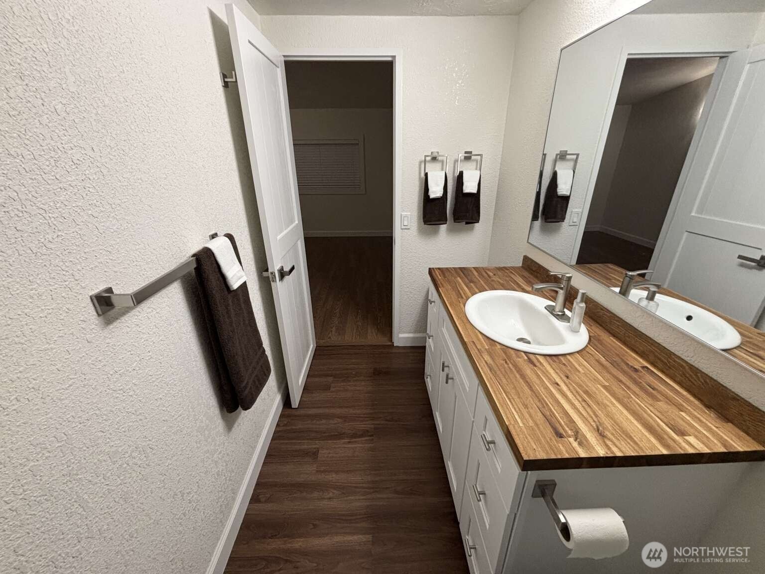 12615 Northeast 189th Street Bothell, WA 98011 - Photo 29 of 40 a bathroom with sink and mirror