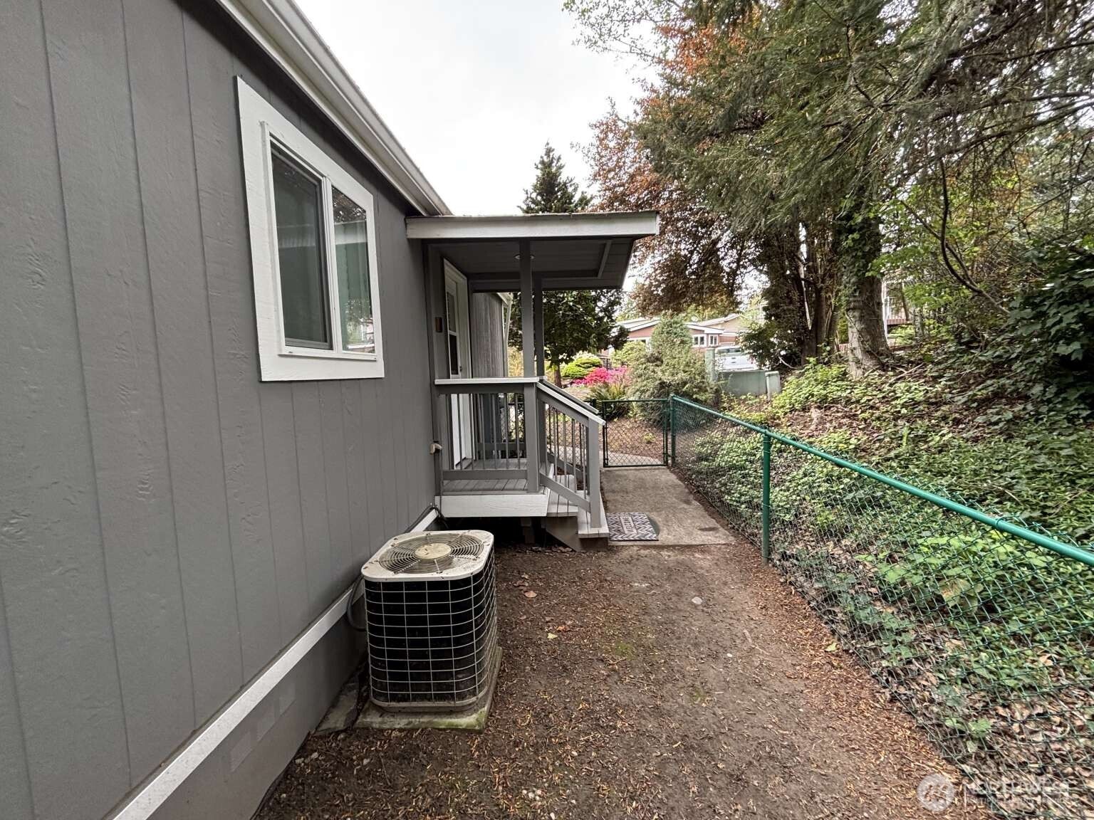 12615 Northeast 189th Street Bothell, WA 98011 - Photo 7 of 40 a front view of a house with chairs