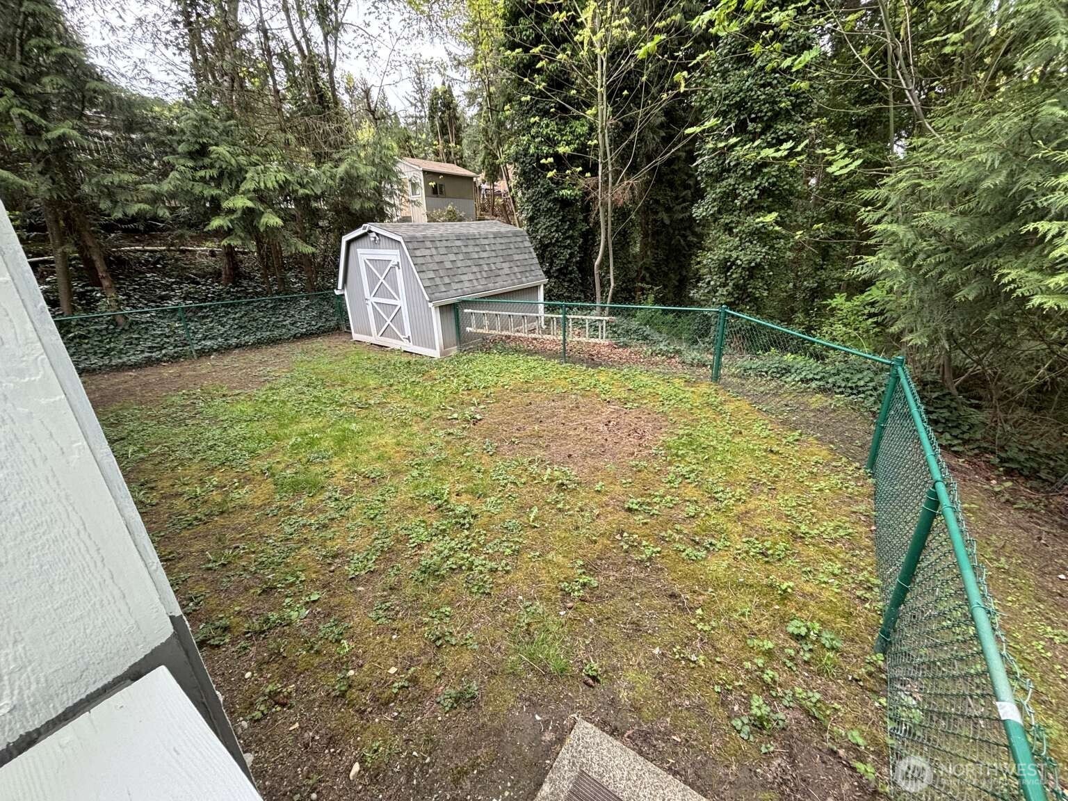 12615 Northeast 189th Street Bothell, WA 98011 - Photo 9 of 40 a backyard of a house with table and chairs