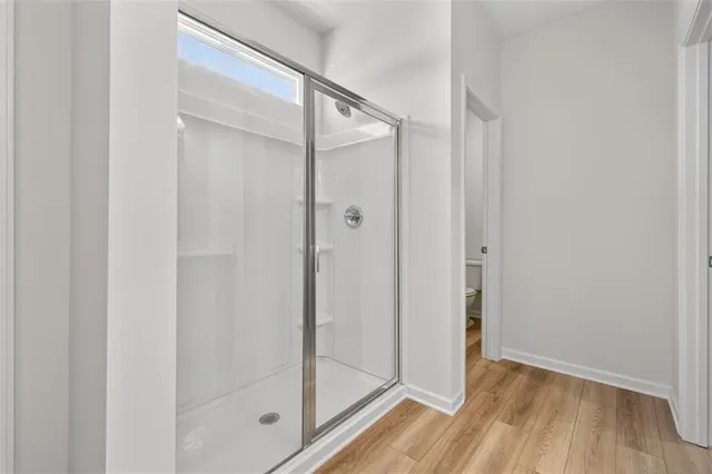 a bathroom with a double vanity sink a toilet and a mirror