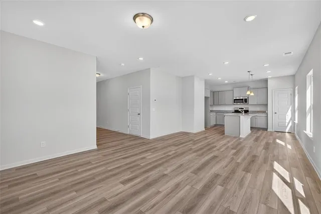 a view of kitchen with wooden floor