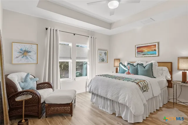 a spacious bedroom with a bed and a couch