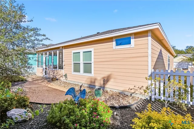 a view of a backyard with sitting area