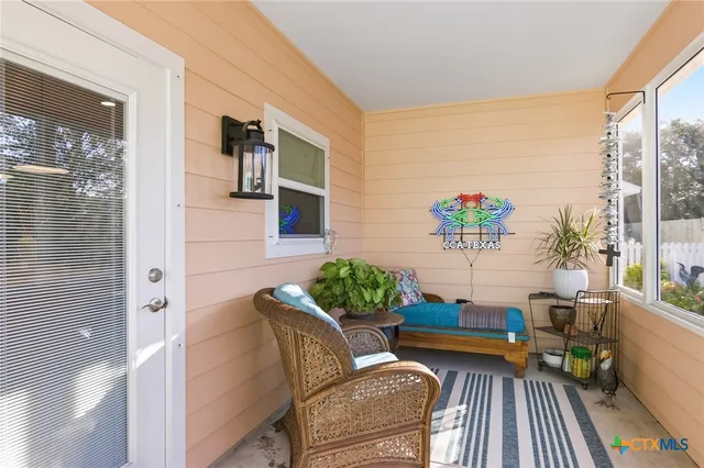a living room with patio furniture
