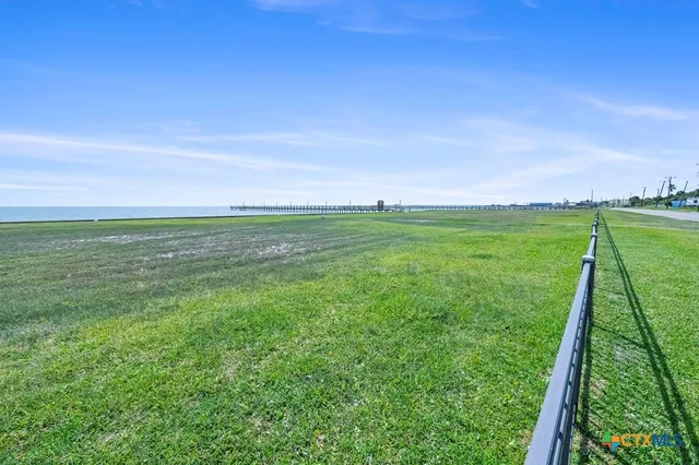 a view of a field with a big yard
