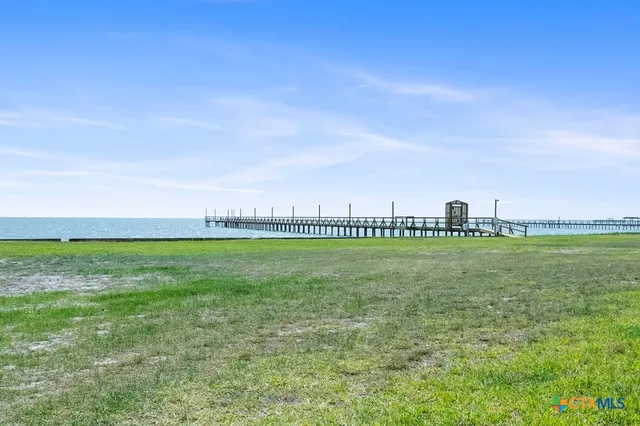 a view of a golf course with a lake