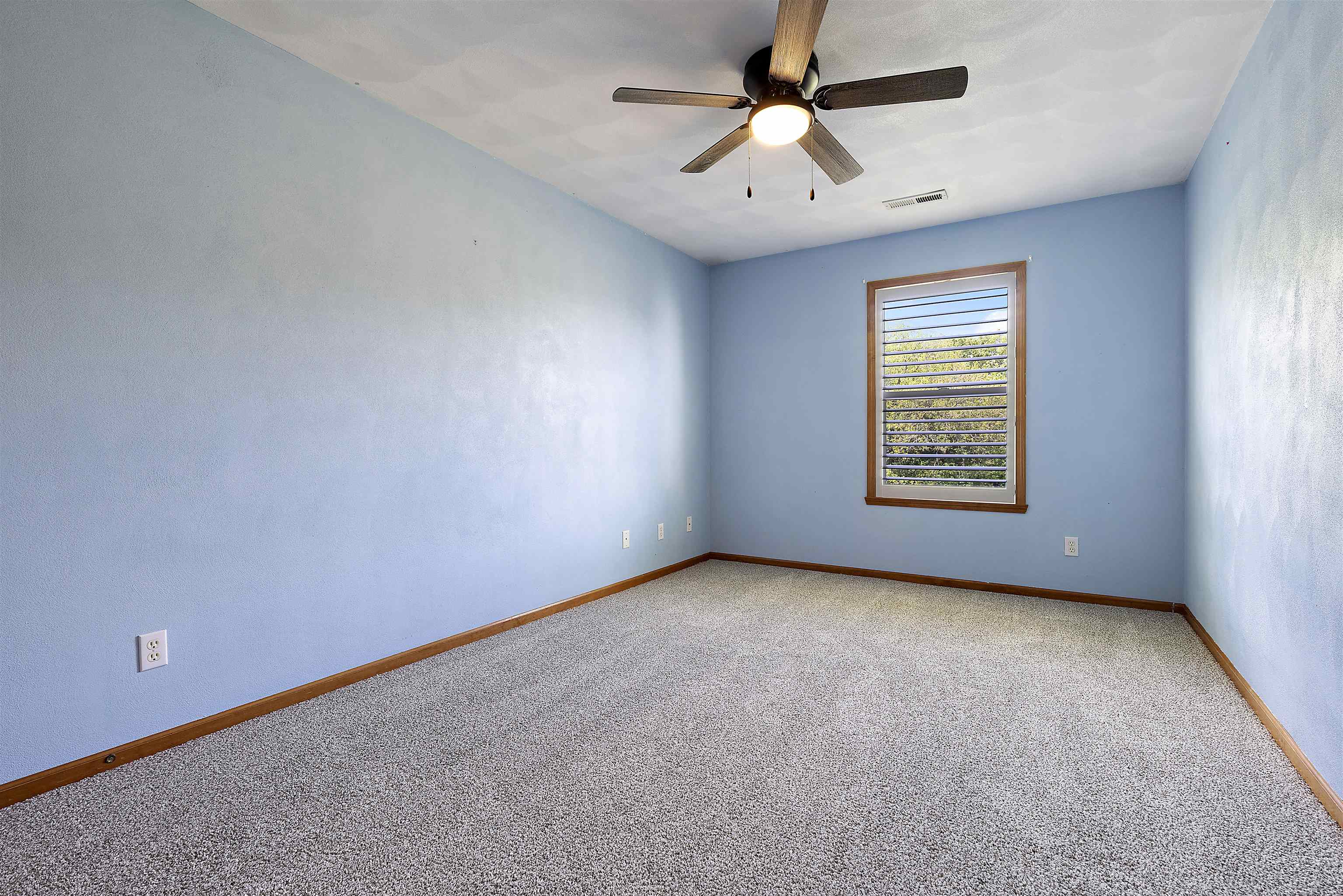 10050 Skipperling Road Roscoe, IL 61073 - Photo 11 of 15 an empty room with windows and fan