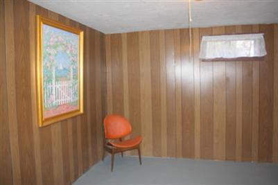 8 Quamhassett Road Buzzards Bay, MA 02532 - Photo 15 of 30 a view of a room with a window and chair