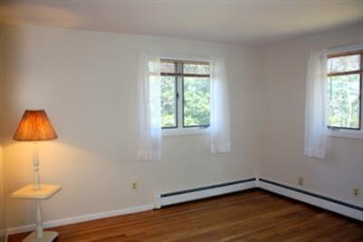 8 Quamhassett Road Buzzards Bay, MA 02532 - Photo 6 of 30 a room with a window and wooden floor