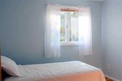 8 Quamhassett Road Buzzards Bay, MA 02532 - Photo 8 of 30 a bedroom with a bed and a window