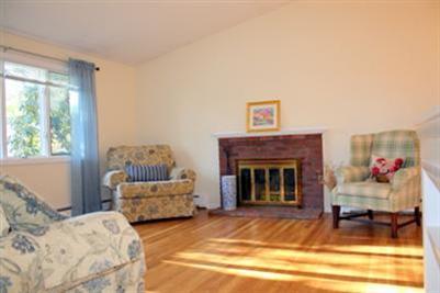 8 Quamhassett Road Buzzards Bay, MA 02532 - Photo 10 of 30 a living room with furniture and a fireplace