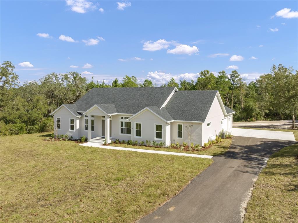 a view of house with outdoor space