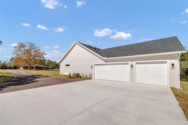 a aerial view of residential houses with yard