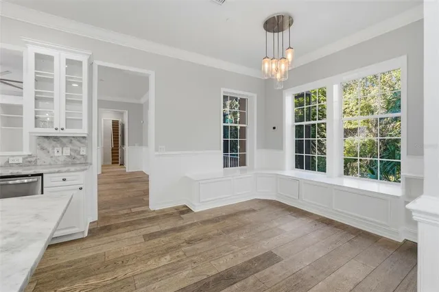 a large kitchen with lots of counter space stainless steel appliances and cabinets