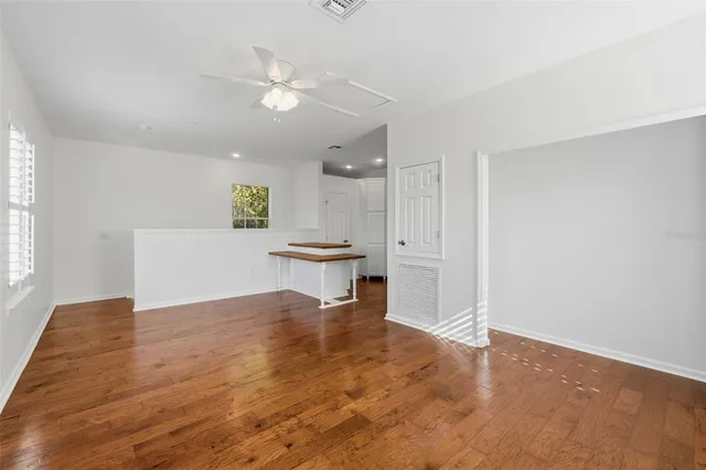 a white bath tub sitting next to a shower