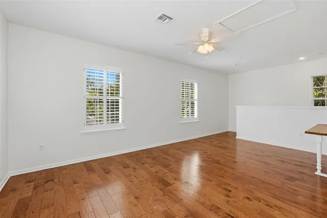 a view of walk in closet with empty racks
