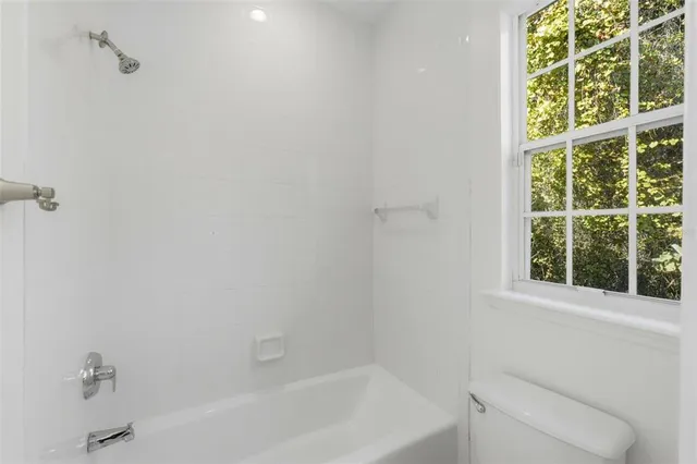 a view of yard with swimming pool and green space