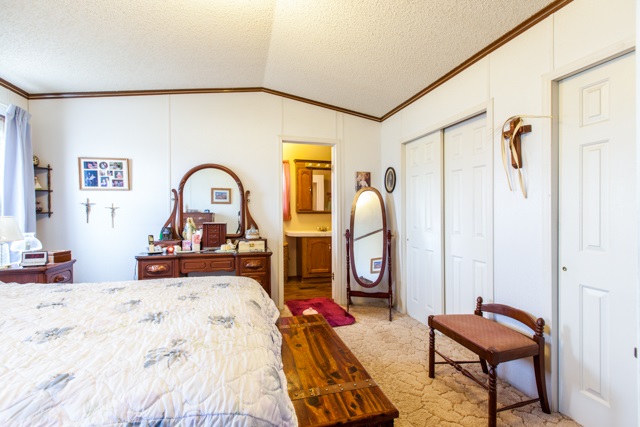 2219 I Road Grand Junction, CO 81505 - Photo 8 of 21 a bed room with a bed and dresser
