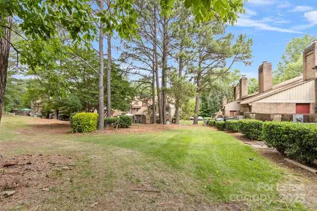 a view of kitchen and hall with wooden floor