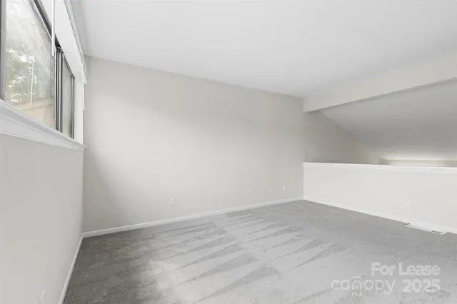 a view of cabinets and wooden floor