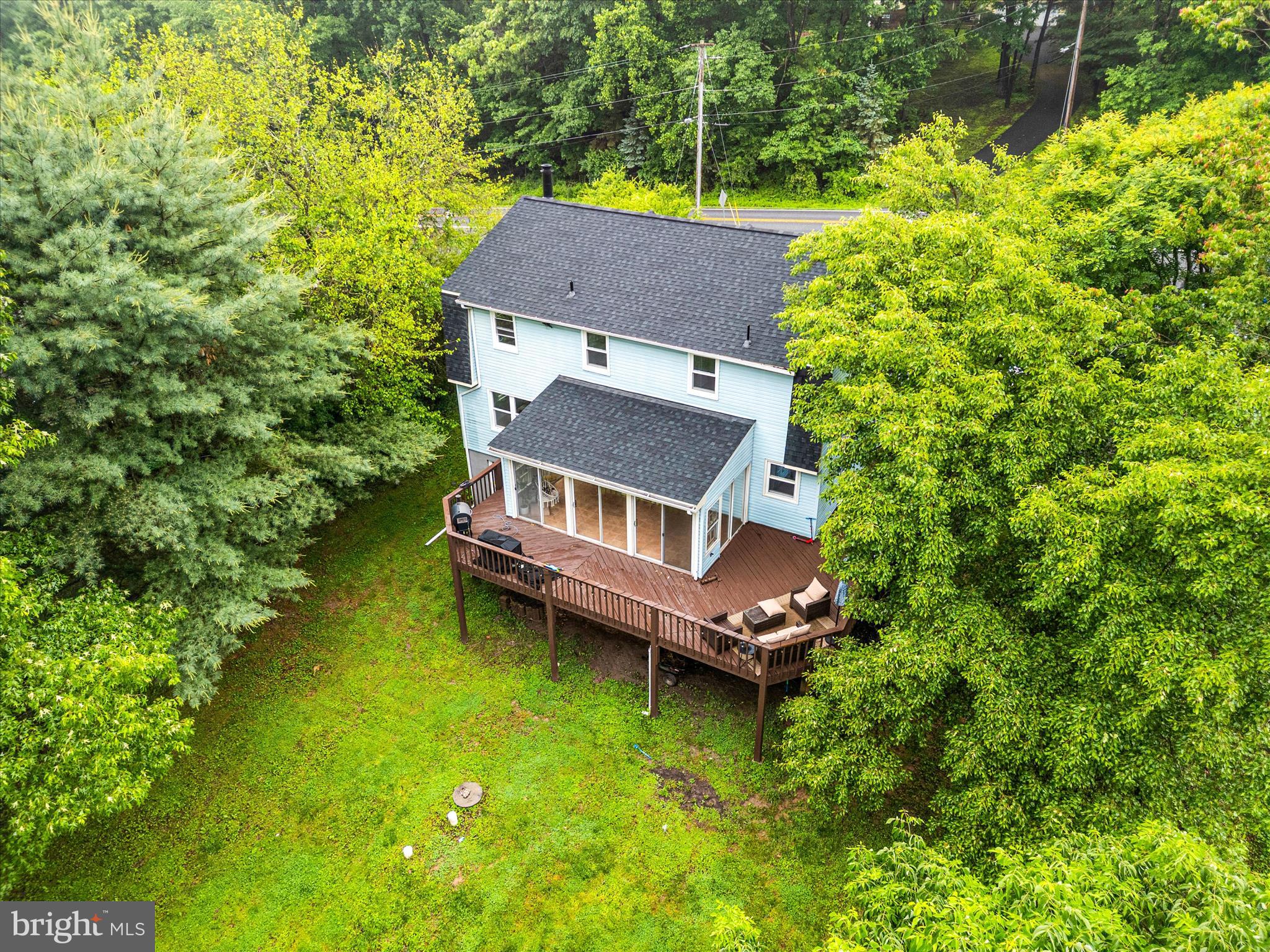 4217 Bill Moxley Road Mount Airy, MD 21771 - Photo 53 of 57 an aerial view of a house with swimming pool garden view and trees