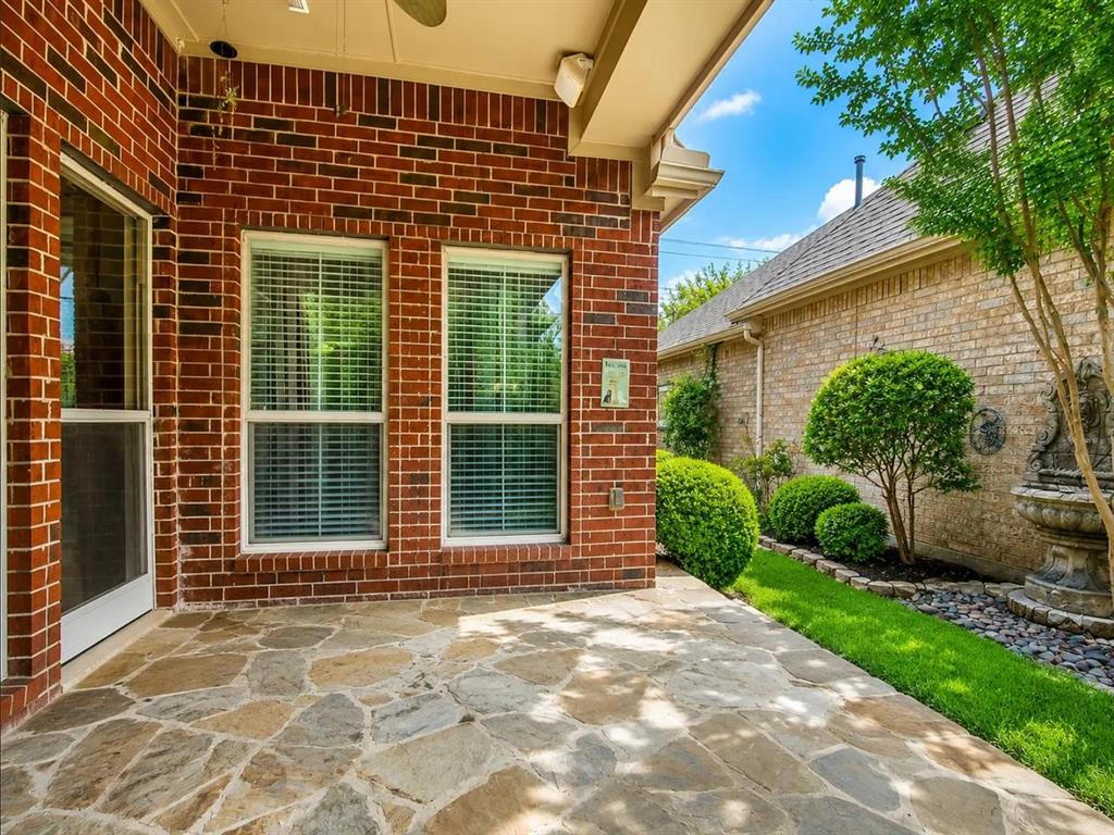 9962 Bell Rock Road Frisco, TX 75035 - Photo 25 of 28 a front view of a house with garden